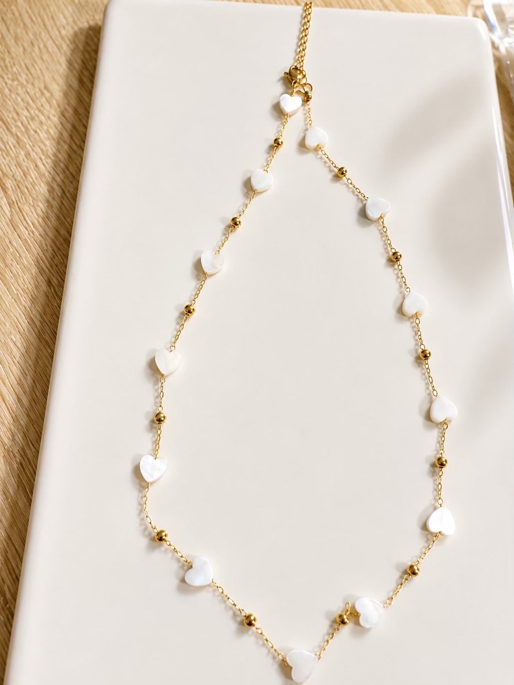 Ensemble collier & bracelet cœurs nacrés dorés