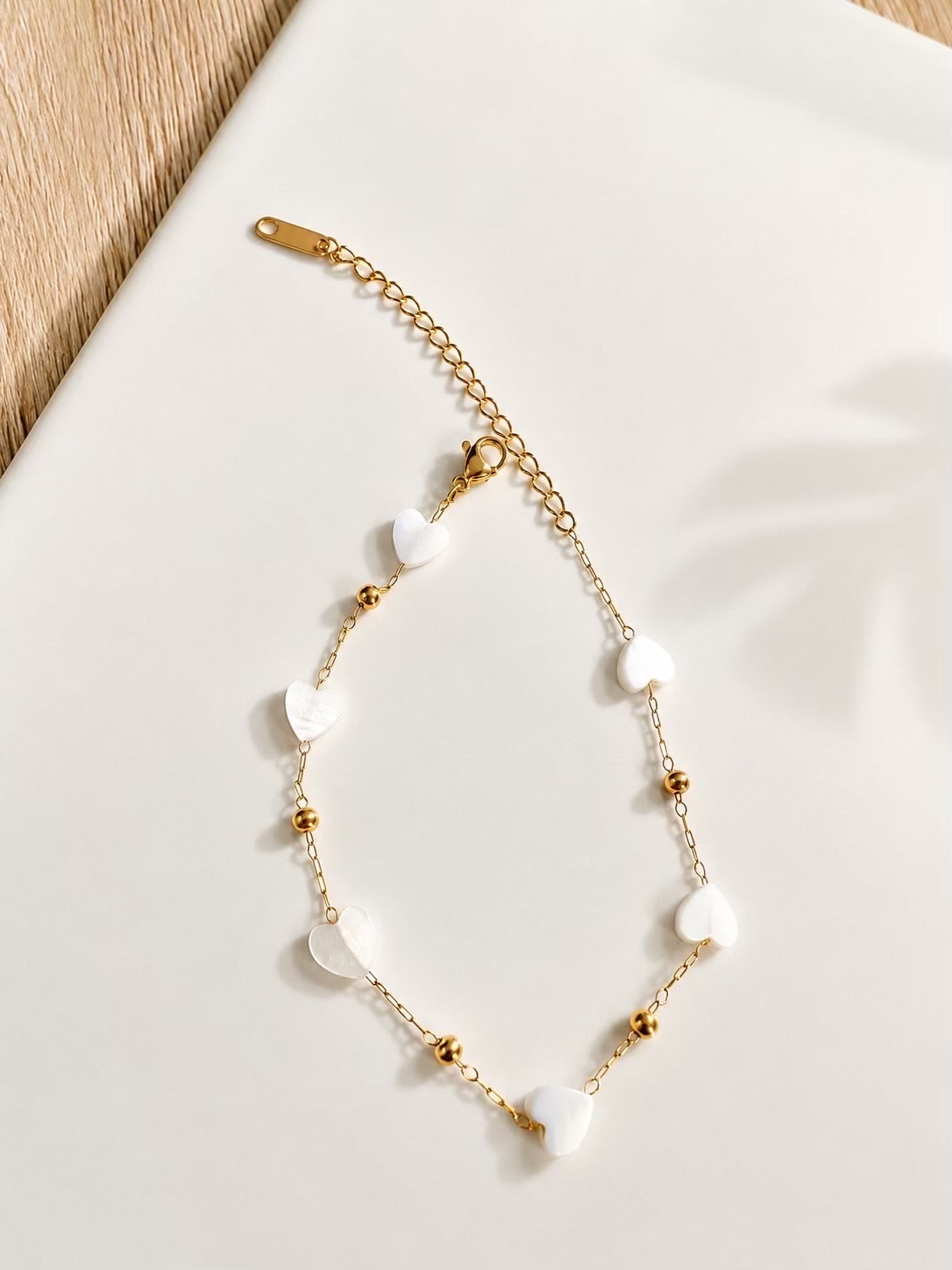 Ensemble collier & bracelet cœurs nacrés dorés